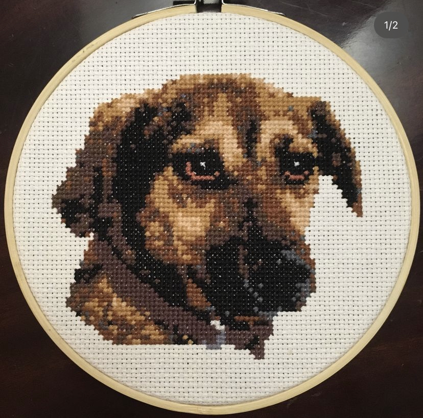 A Cross stich of a dog's face